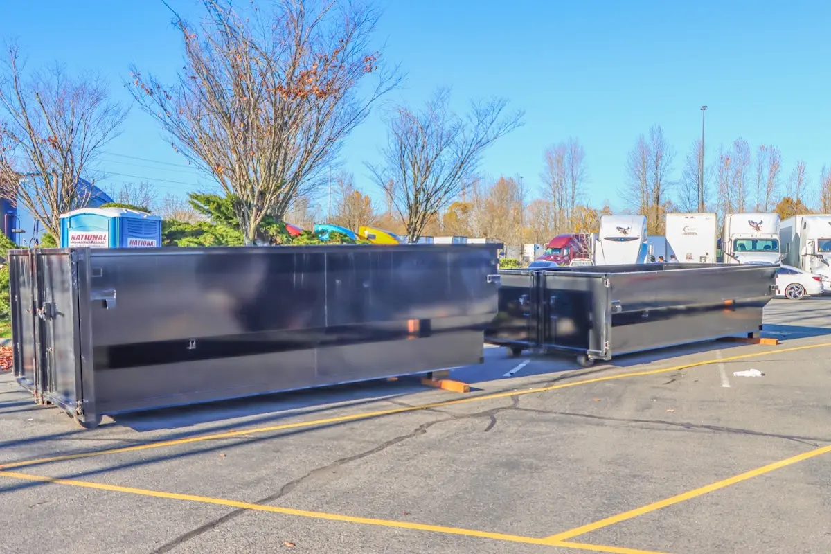 Professional dumpster rental service with roll-off container on residential driveway in Ben Lomond